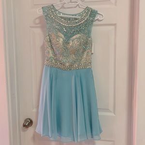 Sample sale! Alyce size 4 light blue, short dress with beading and sequins.